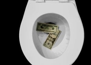 Money being flushed down the toilet